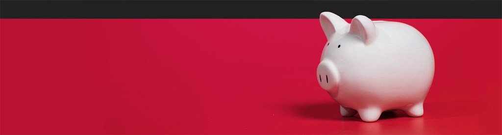 Piggy bank on red background