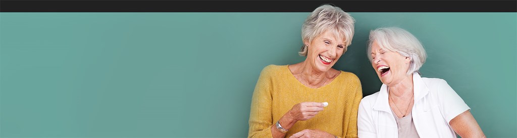 Two ladies laughing together